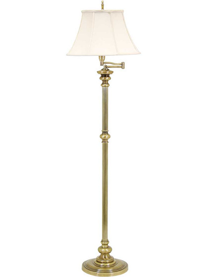 Newport Swing-Arm Floor Lamp in Antique Brass.